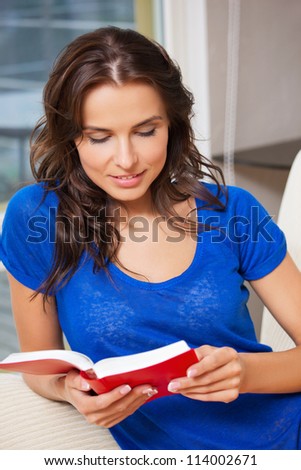 bright picture of happy and smiling woman with book..