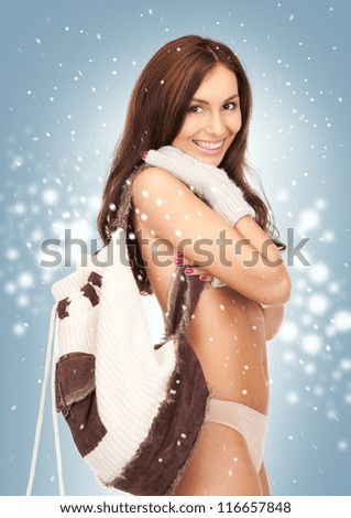 bright picture of beautiful woman in mittens with backpack.