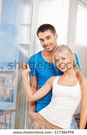 bright picture of happy couple at the window