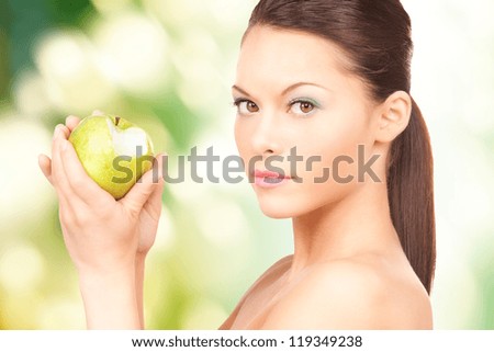 picture of young beautiful woman with green apple.
