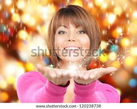 beautiful woman with magic on the palms of her hands