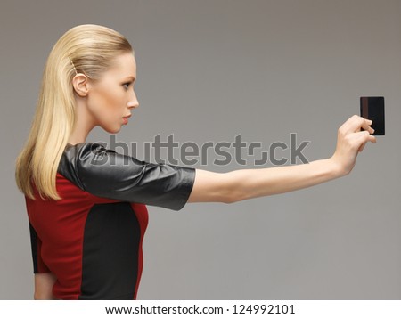 picture of futuristic woman with access card.