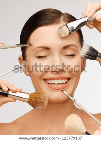 bright closeup portrait picture of beautiful woman with brushes bright closeup portrait picture of beautiful woman with brushes
