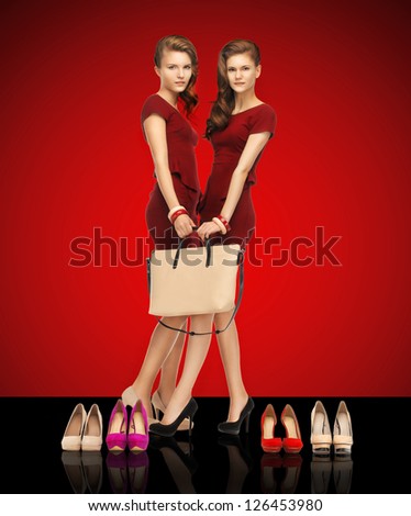 picture of two teenage girls in red dresses with bag