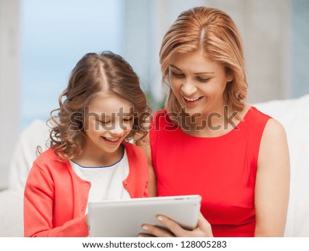 picture of mother and daughter with tablet pc