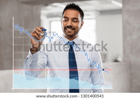 business, statistics and people concept - smiling indian businessman with marker drawing chart on screen or glass wall over office background