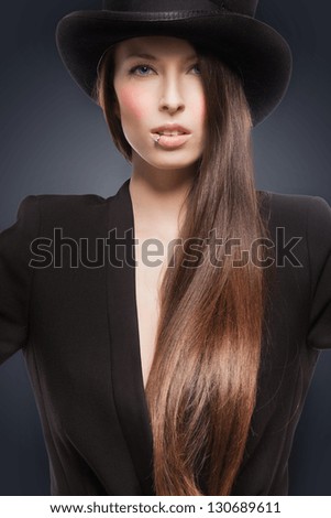 picture of woman in black jacket and top hat