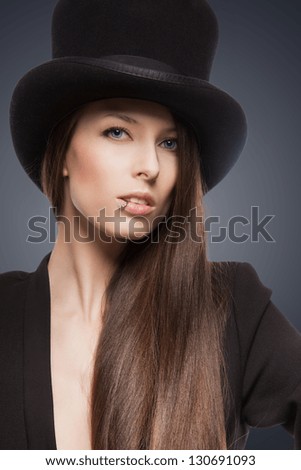 picture of woman in black jacket and top hat
