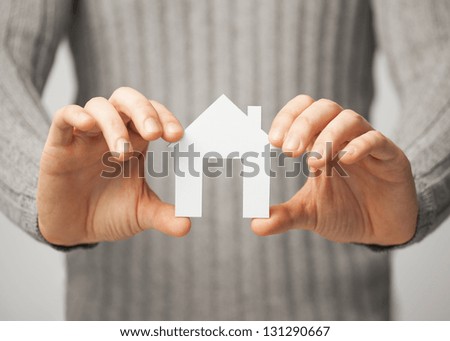 Bright Picture Of Man Holding Paper House