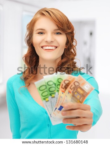 picture of happy teenage girl with euro cash money