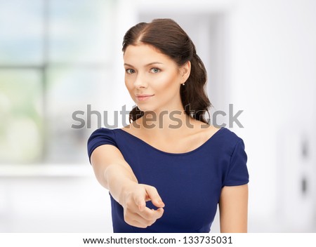 picture of attractive businesswoman pointing her finger