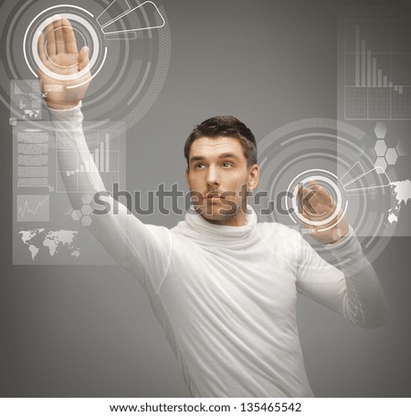 picture of futuristic man working with virtual screens