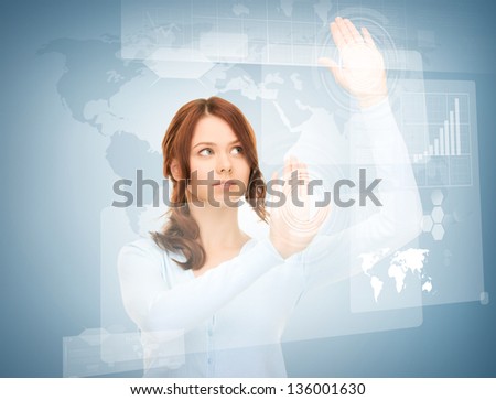 picture of attractive businesswoman touching virtual screen