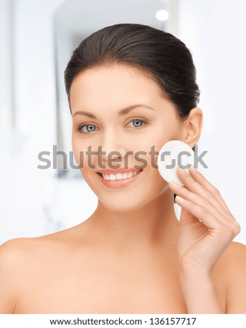 bright picture of beautiful woman with cotton pad