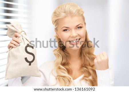 picture of woman with dollar signed bag