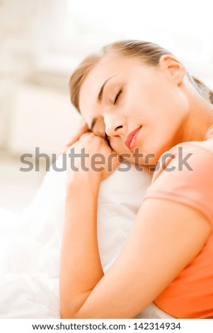 brigh picture of woman sleeping on the couch at home