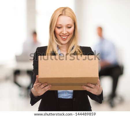 attractive businesswoman with cardboard box in office attractive businesswoman with cardboard box in office