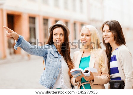Holidays And Tourism Concept - Beautiful Girls Looking For Direction In The City