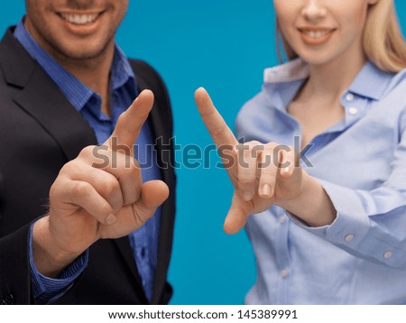 picture of man and woman hands pointing at something