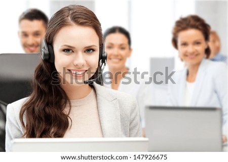 Business And Technology Concept - Helpline Operator With Headphones In Call Centre