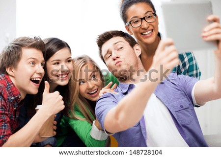 Technology Concept - Group Of Students Making Picture With Tablet Pc