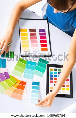 Interior Design, Renovation And Technology Concept - Woman Working With Color Samples For Selection