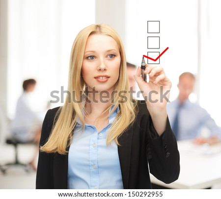 Business And Technology Concept - Businesswoman Drawing Checkmark On Virtual Screen