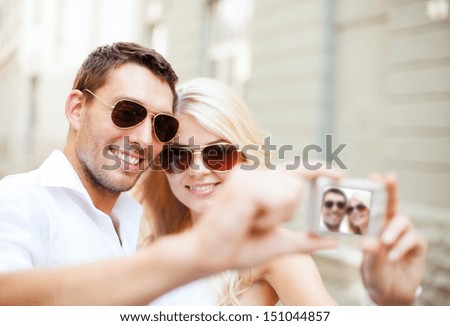 Summer Holidays And Dating Concept - Couple Taking Photo In Cafe In The City