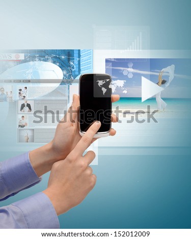 technology, internet, tv and news concept - woman hand with smartphone, videos and virtual screen