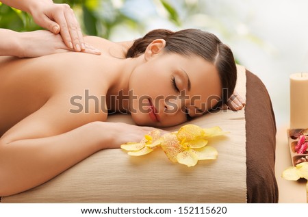 Beauty, Holidays And Spa Concept - Woman In Spa Salon Getting Massage