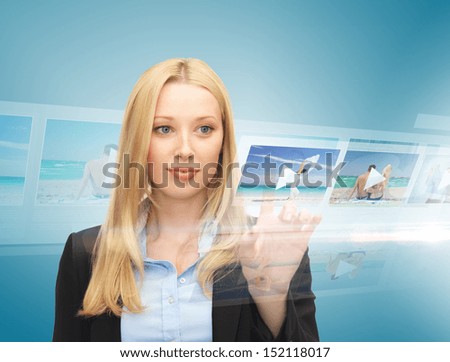 technology, internet, tv and news concept - businesswoman pressing button on virtual screen with videos