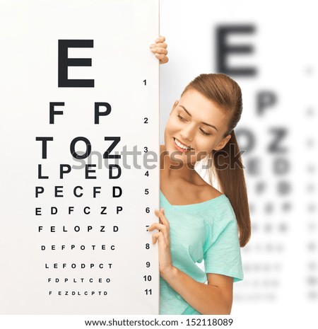 Medicine And Vision Concept - Woman In Eyeglasses With Eye Chart