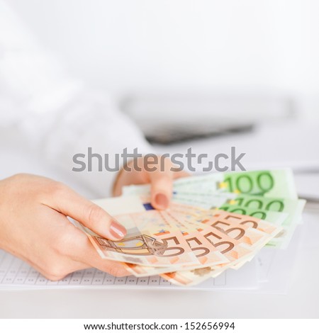 Business, Office, Household, Banking, Tax, Gambling Concept - Woman Hands With Euro Cash Money