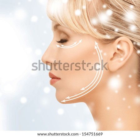 health and beauty concept - beautiful young woman face with arrows