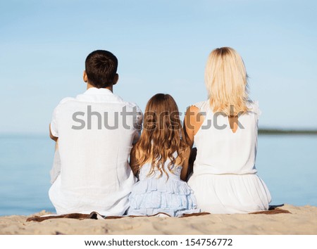 summer holidays, celebration, children and people concept - happy family at the seaside