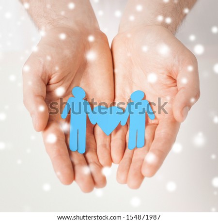 love, romance, human rights, gay, family concept - man hands showing two paper men with heart shape