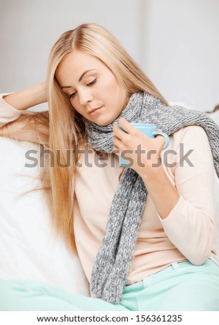health and illness concept - indoor picture of diseased woman with cup of tea