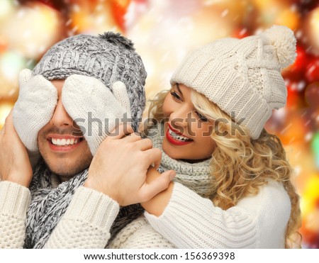 christmas, x-mas, winter, happiness concept - family couple in a winter clothes