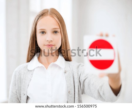education, school and anti-bullying concept - student girl showing no entry sign