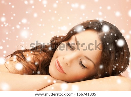 health and beauty concept - beautiful woman with long eyelashes in spa