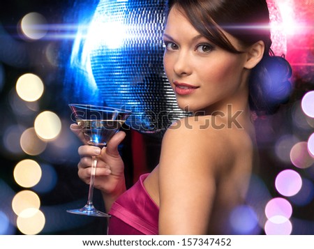 Luxury, Vip, Nightlife, Party Concept - Beautiful Woman In Evening Dress With Cocktail And Disco Ball