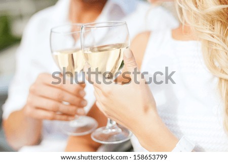 Summer Holidays And Dating Concept - Couple Drinking Wine In Cafe In The City