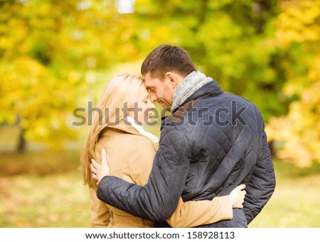 Holidays, Love, Travel, Tourism, Relationship And Dating Concept - Romantic Couple Kissing In The Autumn Park