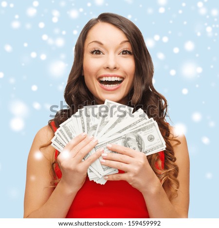 christmas, x-mas, sale, banking concept - smiling woman in red dress with us dollar money