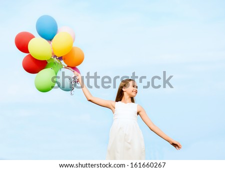 Summer Holidays, Celebration, Family, Children And People Concept - Happy Girl With Colorful Balloons