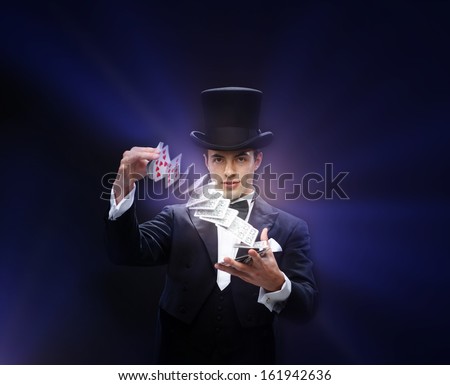 Magic, Performance, Circus, Gambling, Casino, Poker, Show Concept - Magician In Top Hat Showing Trick With Playing Cards