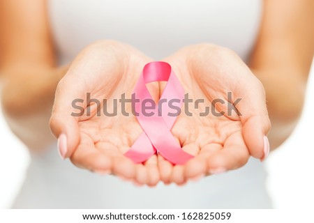 healthcare and medicine concept womans hands holding pink breast cancer awareness ribbon healthcare and medicine concept womans hands holding pink breast cancer awareness ribbon