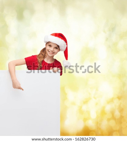 christmas, x-mas, people, advertisement, sale concept - happy girl child in santa helper hat with blank white board