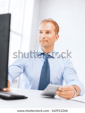 Business, Office, Tax, School And Education Concept - Smiling Businessman With Calculator, Computer And Papers