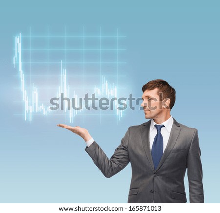 business, money and office concept - attractive buisnessman or teacher in suit showing forex chart on the palm